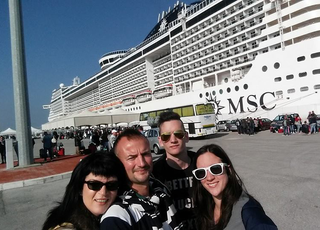 Another family photo next to the ship